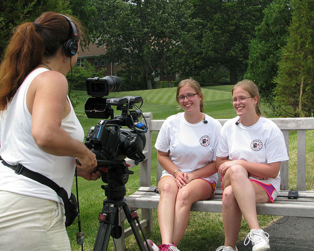 My sister and I being recorded for ThanksUSA videos after the 2013 Tennis Tournament